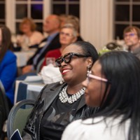 People smiling at screen